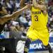 Michigan freshman Trey Burke moves the ball around Ohio University defense in the first half of the second round of the NCAA tournament at Bridgestone Arena in Nashville, Tenn.  Melanie Maxwell I AnnArbor.com